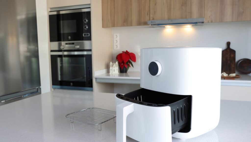 Big white air fryer in the clean table