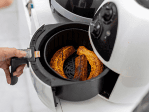 Plantains cooked in an air fryer basket