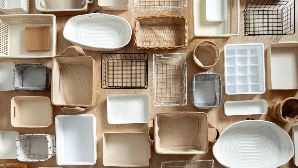 An assortment of different types of storage baskets and bins arranged neatly.