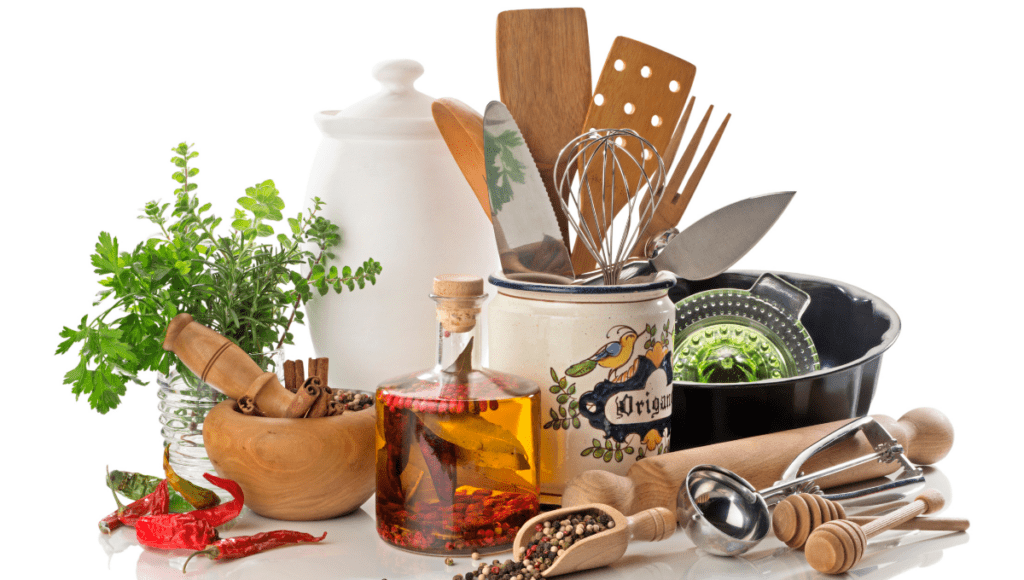 Assorted kitchen utensils, spices, and cooking ingredients arranged on a white background.