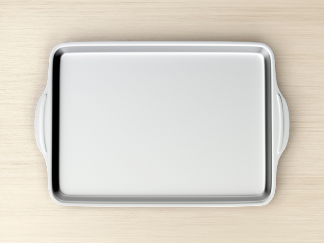 Empty baking tray on a wooden table.