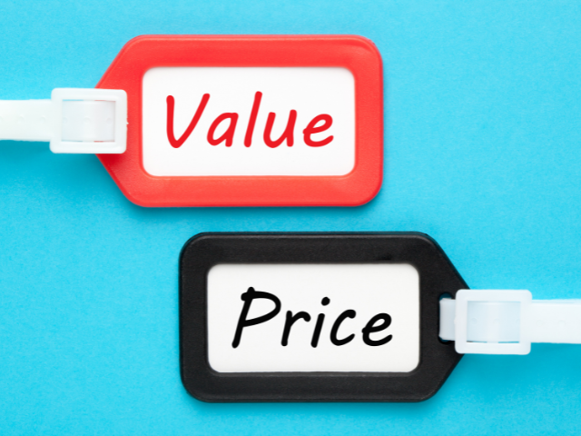 Two price tags: one red with the word "Value" and one black with the word "Price," displayed against a bright blue background.